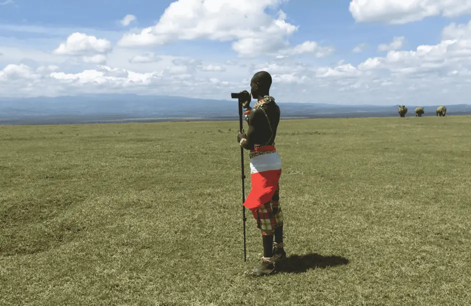 A massai taking a landscap photo